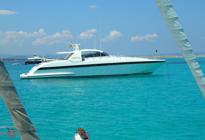 Yachts mooring at the Espalmador Beach Yachts mooring at the Espalmador Beach