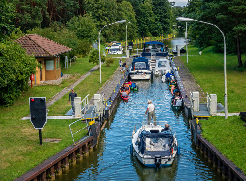 Motorboats settle into a lock