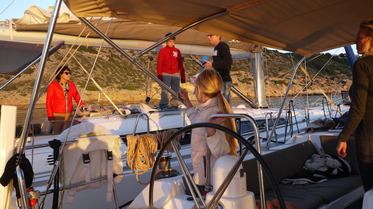 This photo shows a charter crew on a sailboat Charter a sailing boat